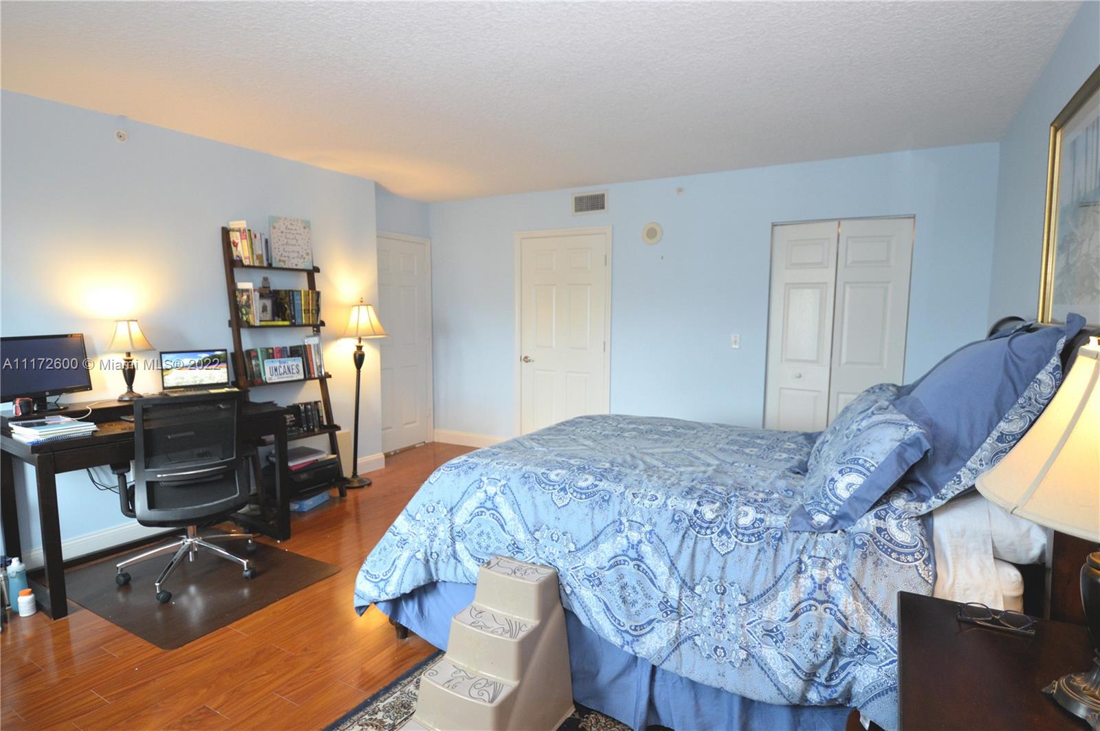 3000 Coral Way, Unit 521 Miami, FL 33145 - Photo 11 of 24 a bed room with a bed and a computer on a desk