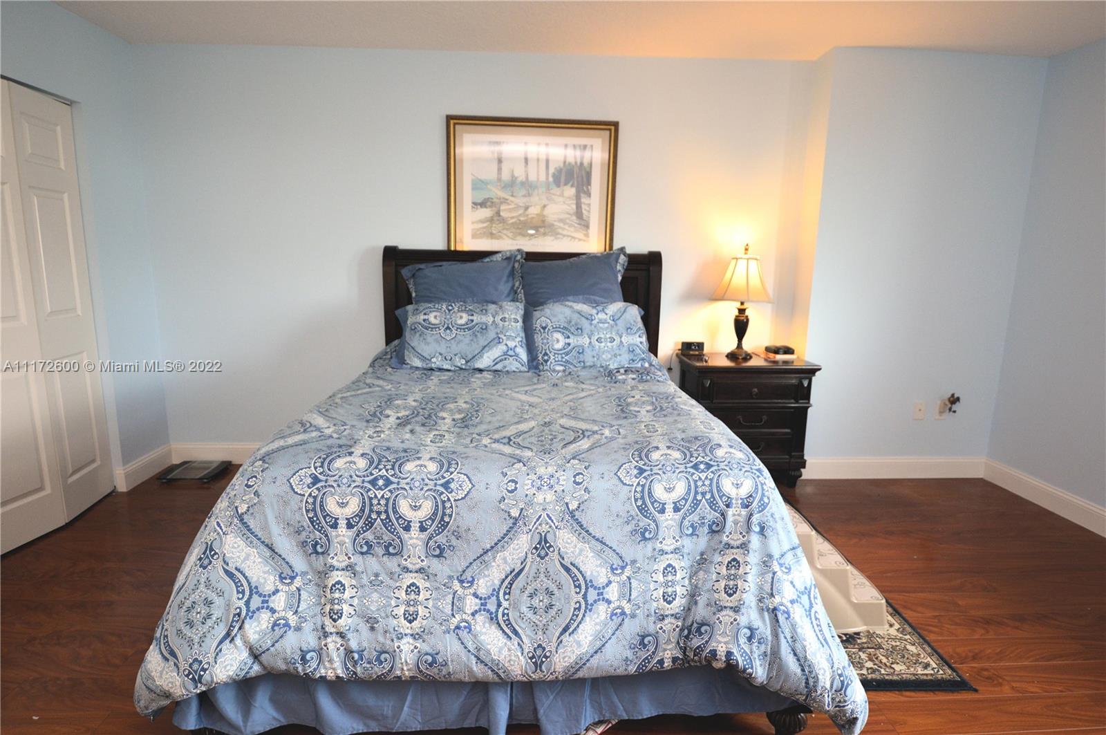 3000 Coral Way, Unit 521 Miami, FL 33145 - Photo 12 of 24 a bedroom with a bed and wooden floor