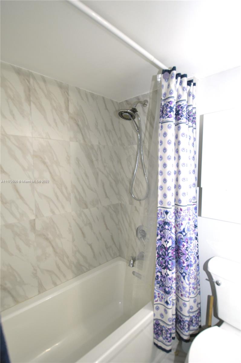 3000 Coral Way, Unit 521 Miami, FL 33145 - Photo 16 of 24 a bathroom with a bathtub and shower