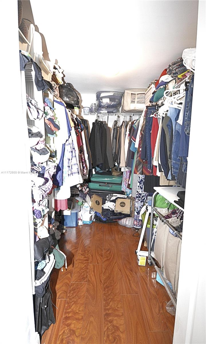 3000 Coral Way, Unit 521 Miami, FL 33145 - Photo 17 of 24 a view of walk in closet with clothes