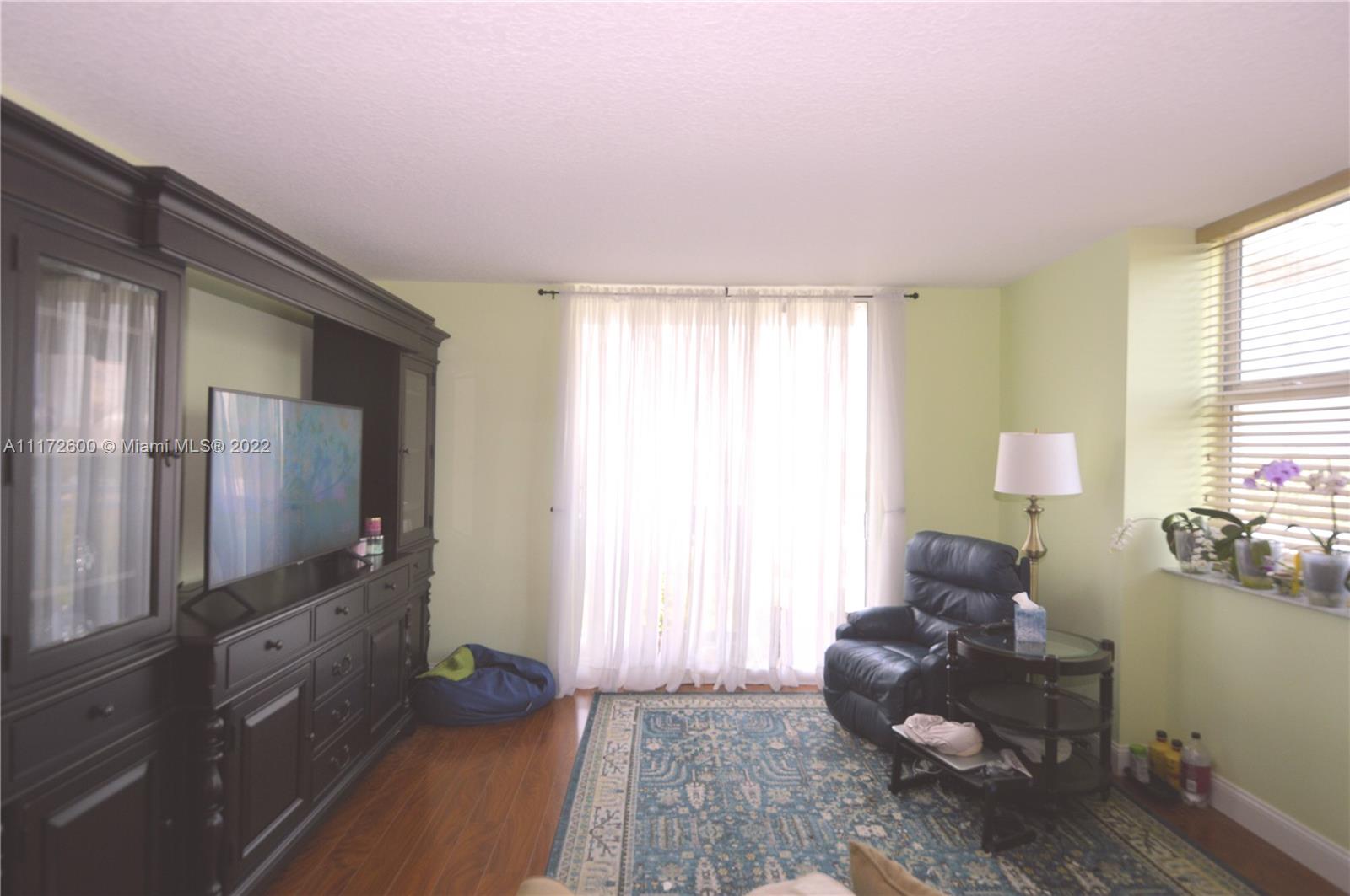 3000 Coral Way, Unit 521 Miami, FL 33145 - Photo 9 of 24 a living room with furniture and a window