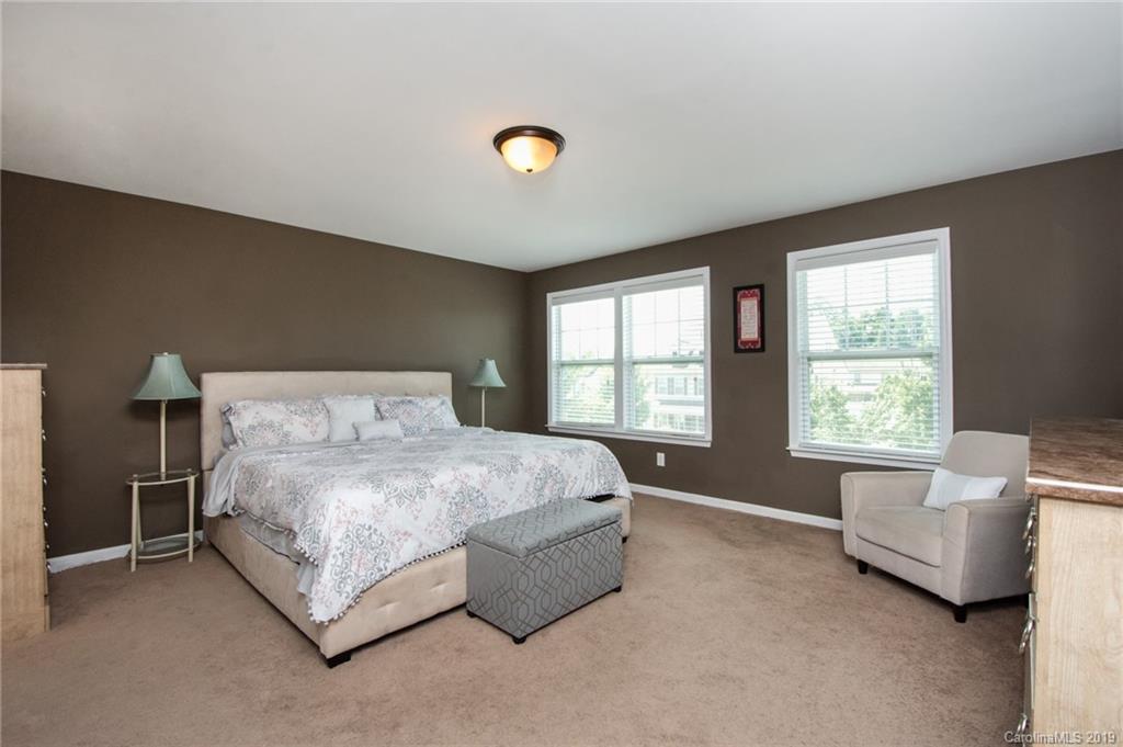 7059 Meyer Road Fort Mill, SC 29715 - Photo 17 of 30 a bedroom with a bed and a couch