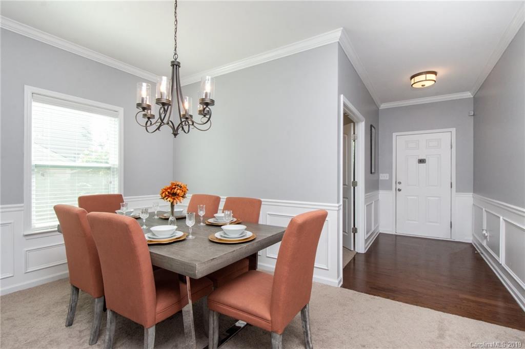 7059 Meyer Road Fort Mill, SC 29715 - Photo 3 of 30 a view of a dining room with furniture window and wooden floor