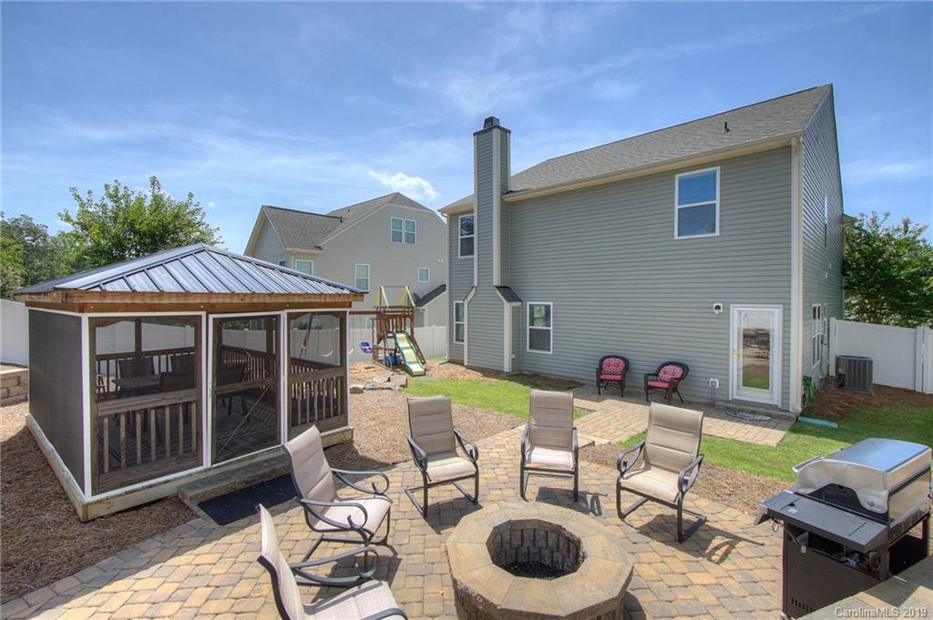 7059 Meyer Road Fort Mill, SC 29715 - Photo 24 of 30 a view of a house with backyard sitting area and garden