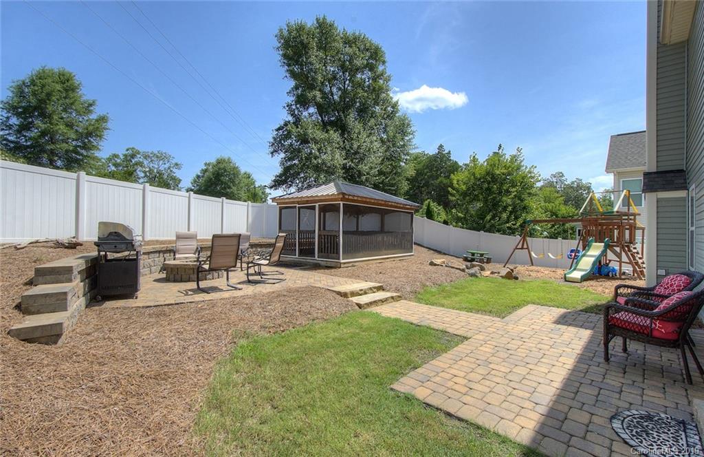 7059 Meyer Road Fort Mill, SC 29715 - Photo 25 of 30 a view of a backyard with furniture and a garden