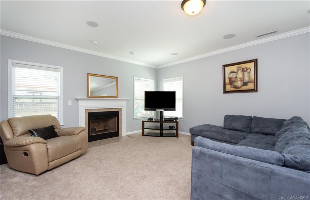 7059 Meyer Road Fort Mill, SC 29715 - Photo 8 of 30 a living room with furniture and a fireplace
