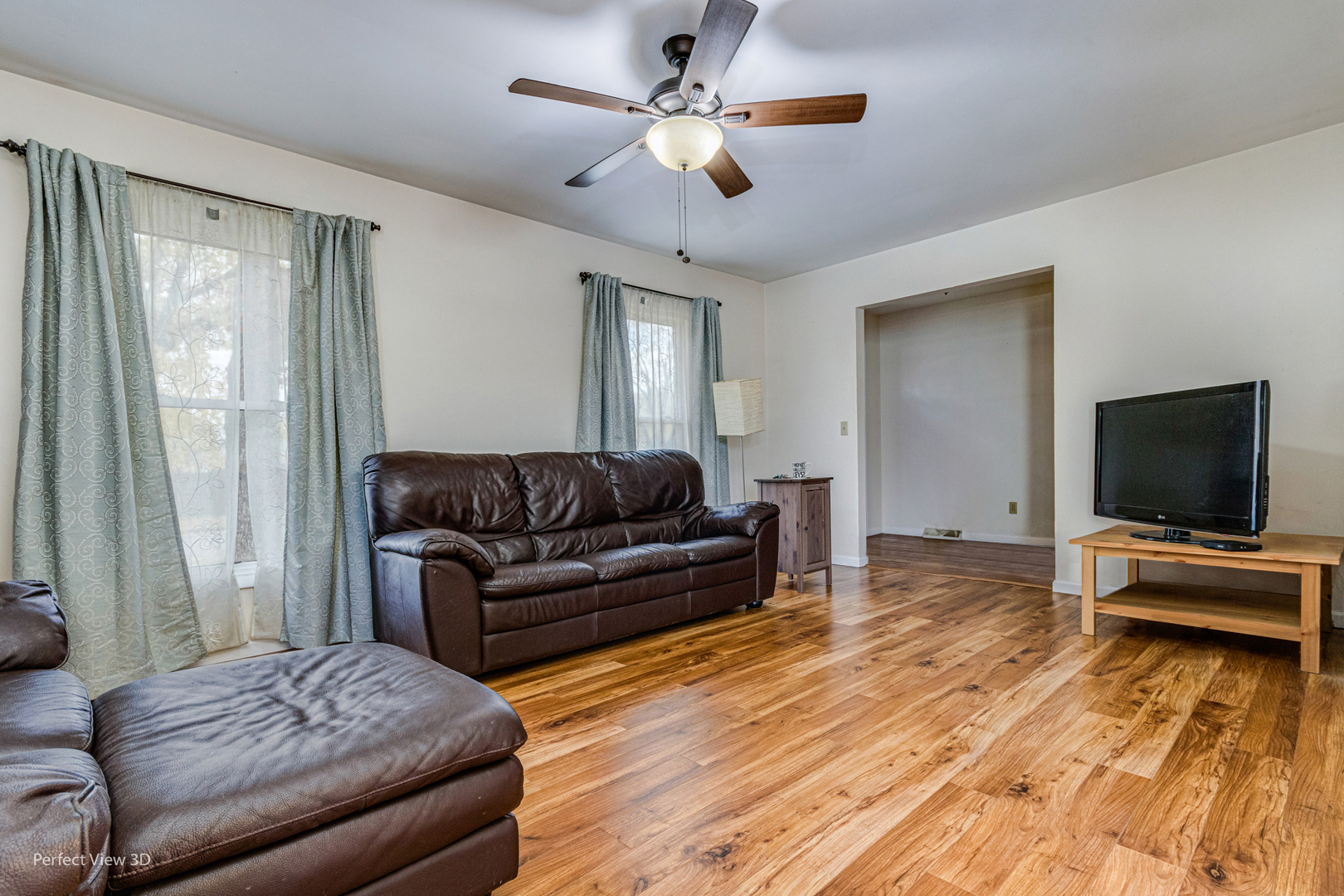 12 Roulock Road Montgomery, IL 60538 - Photo 3 of 17 a living room with furniture and a flat screen tv