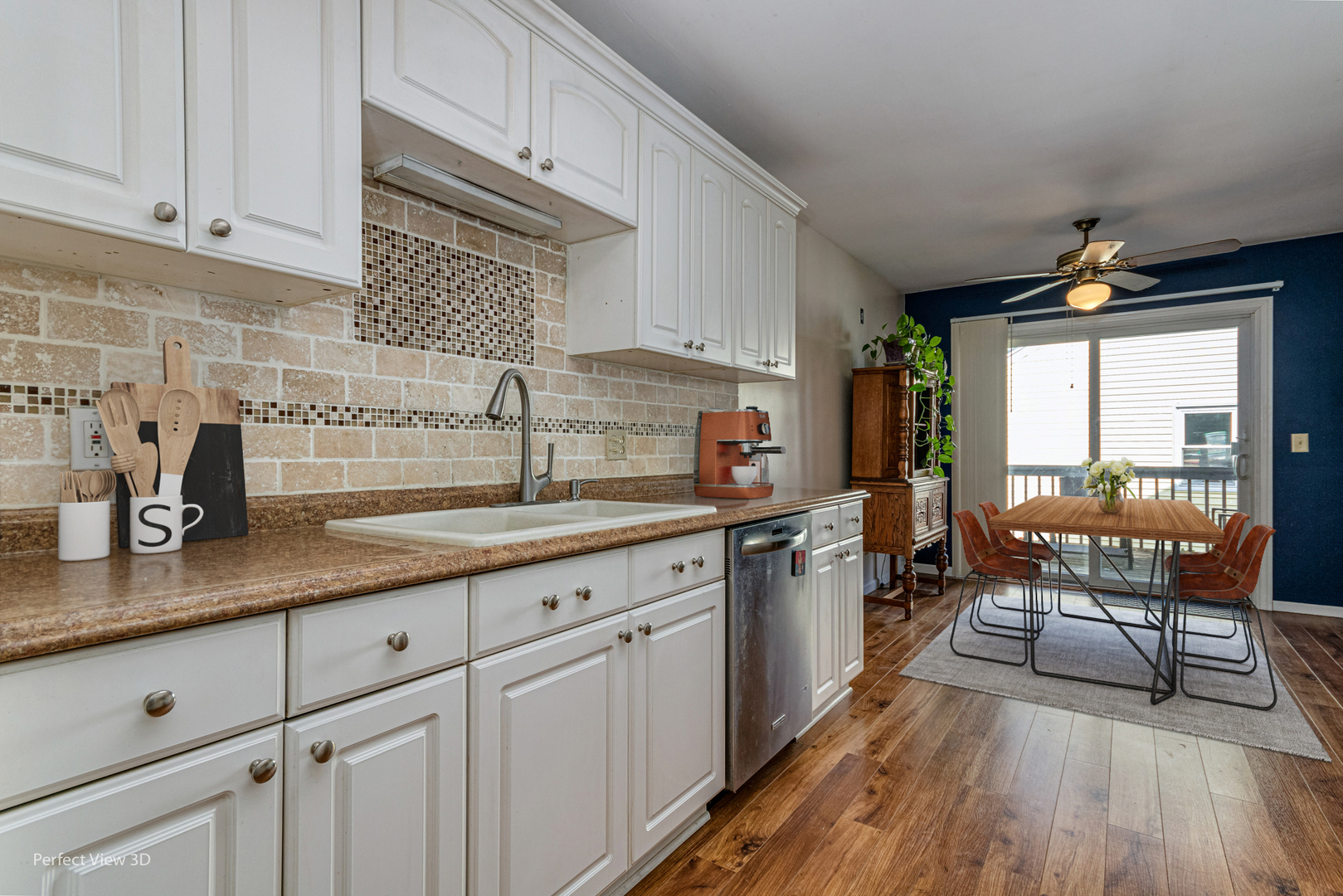 12 Roulock Road Montgomery, IL 60538 - Photo 5 of 17 a kitchen with sink cabinets and wooden floor