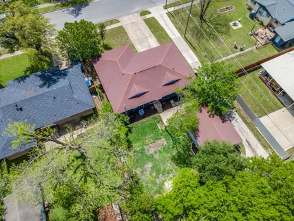 an aerial view of a house with a garden