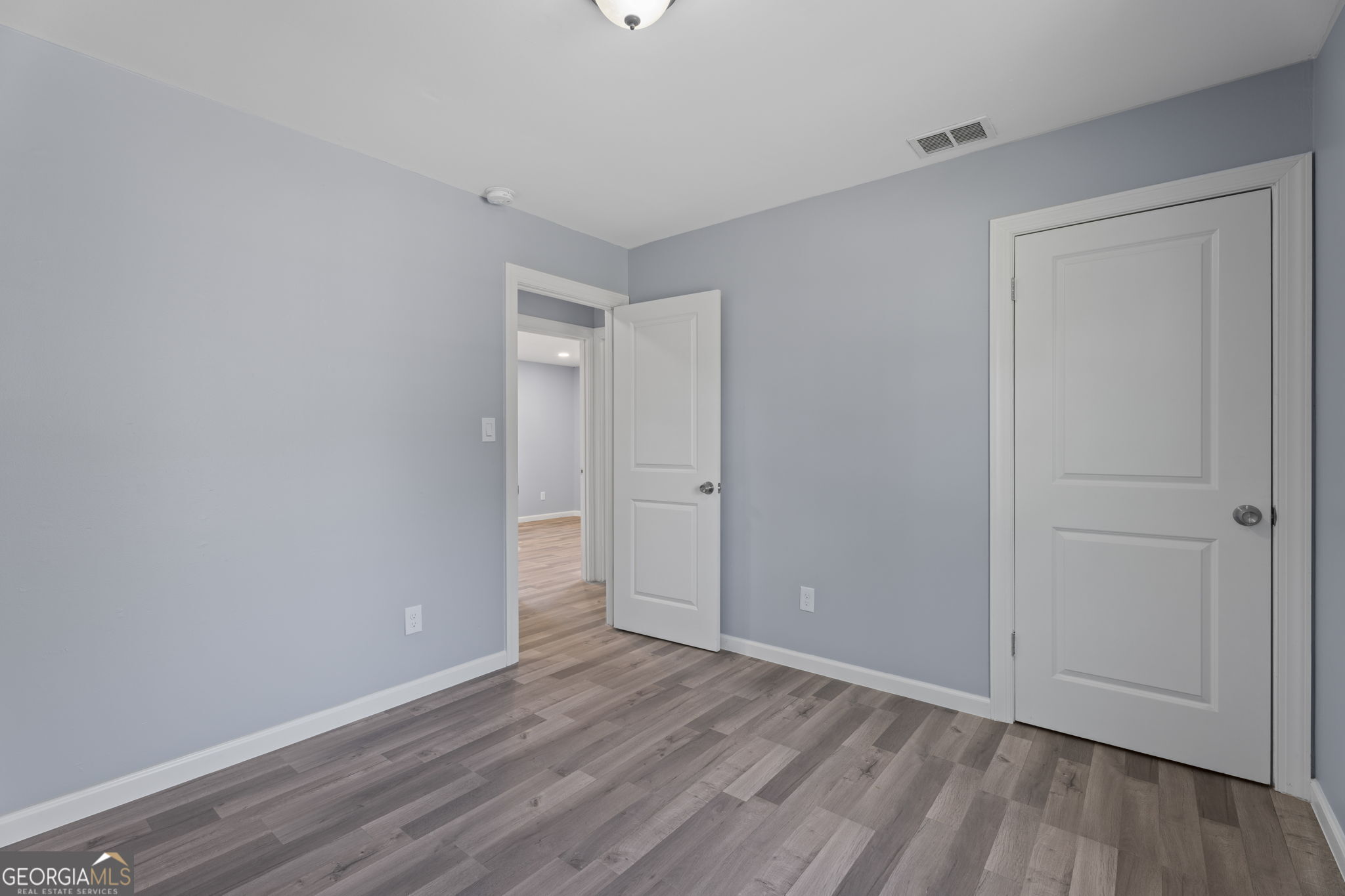 1685 Kinglet Road Jonesboro, GA 30238 - Photo 15 of 34 a view of an empty room and wooden floor
