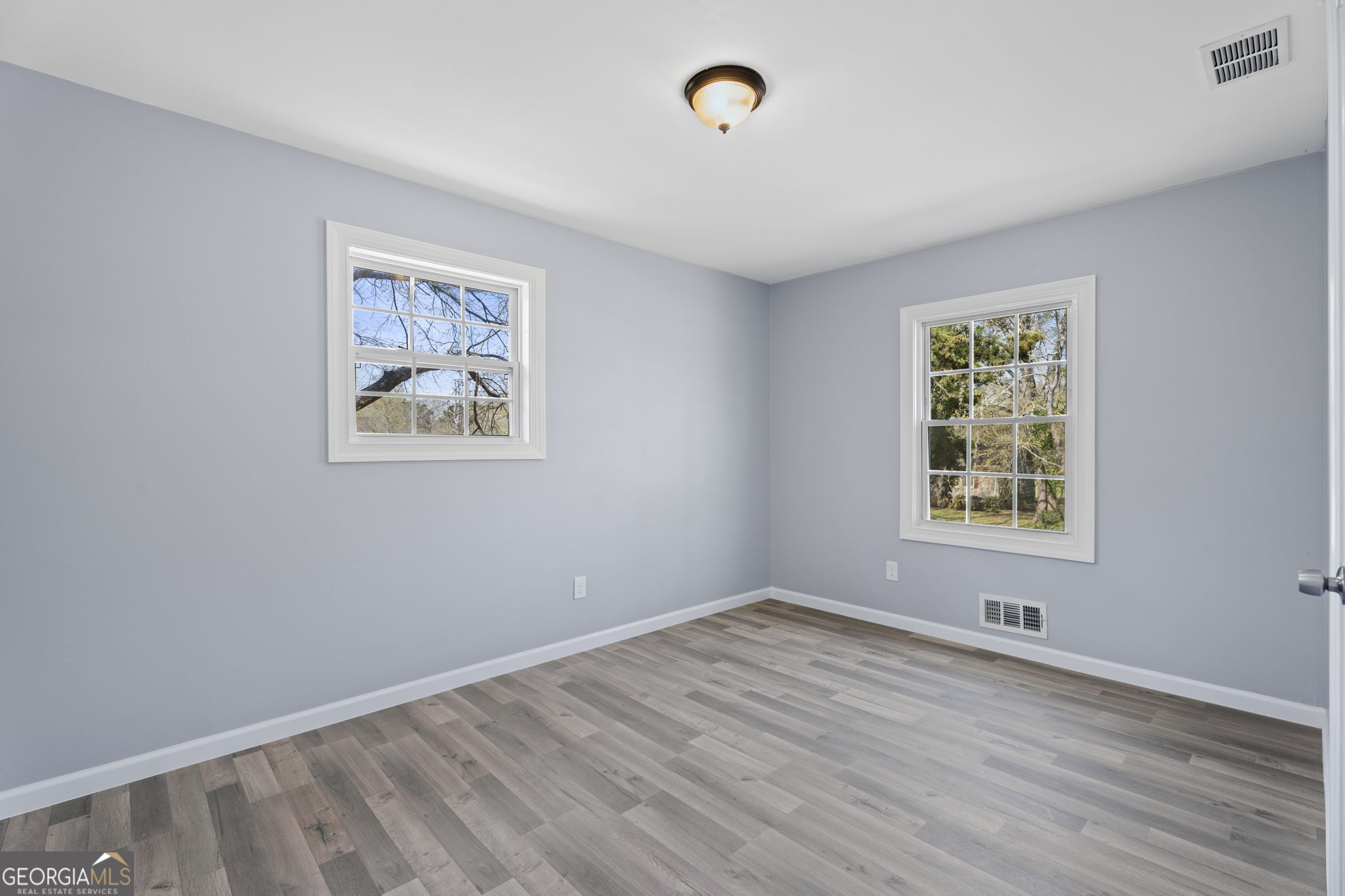 1685 Kinglet Road Jonesboro, GA 30238 - Photo 16 of 34 a view of room with window and hardwood floor