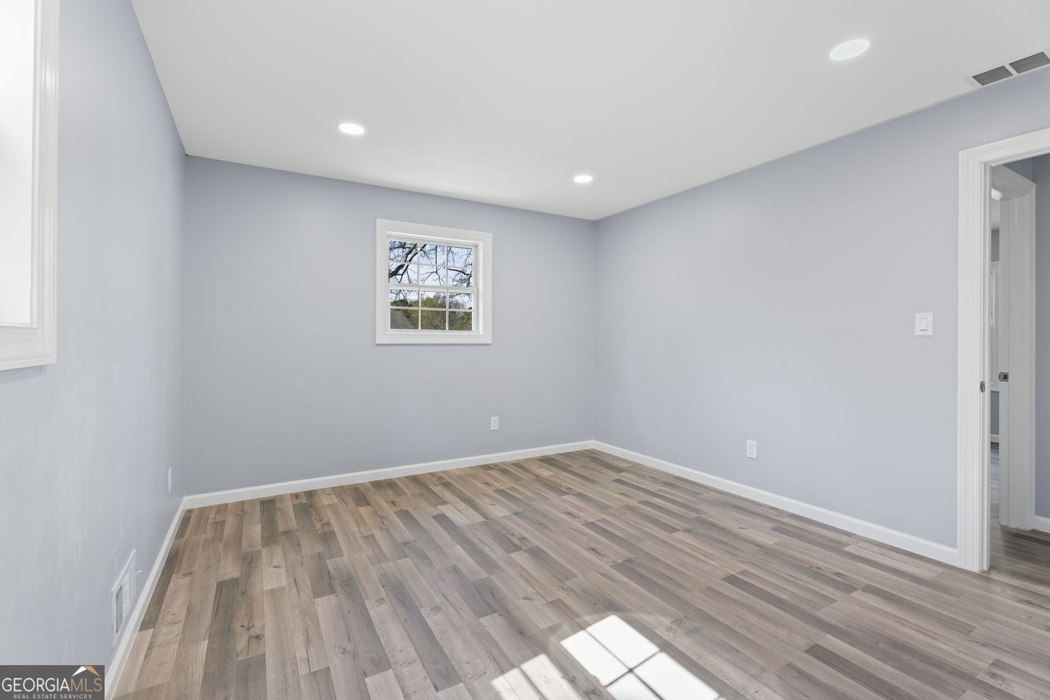 1685 Kinglet Road Jonesboro, GA 30238 - Photo 19 of 34 a view of room with wooden floor and window