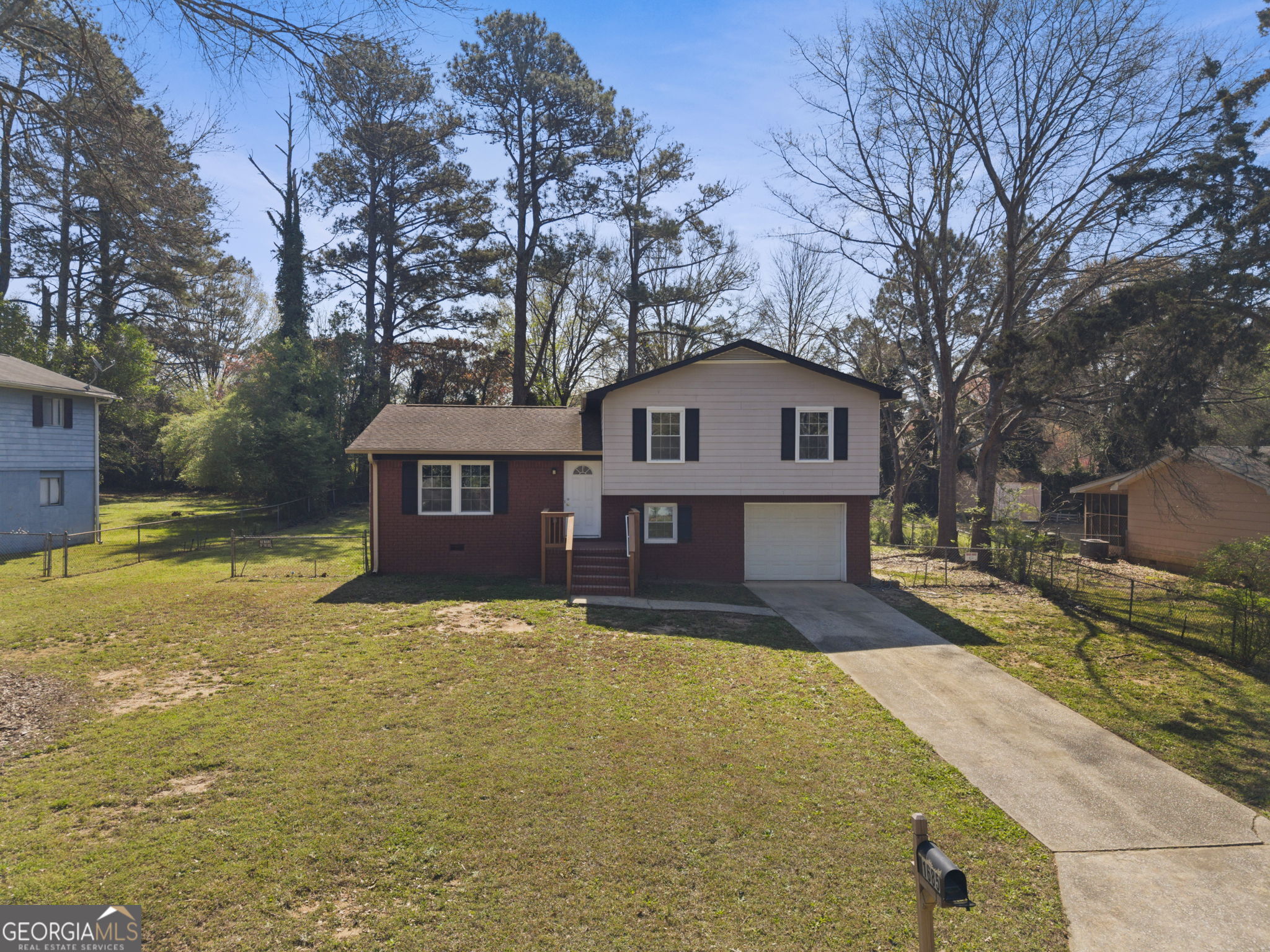 1685 Kinglet Road Jonesboro, GA 30238 - Photo 2 of 34 a house view with a large tree in front of it