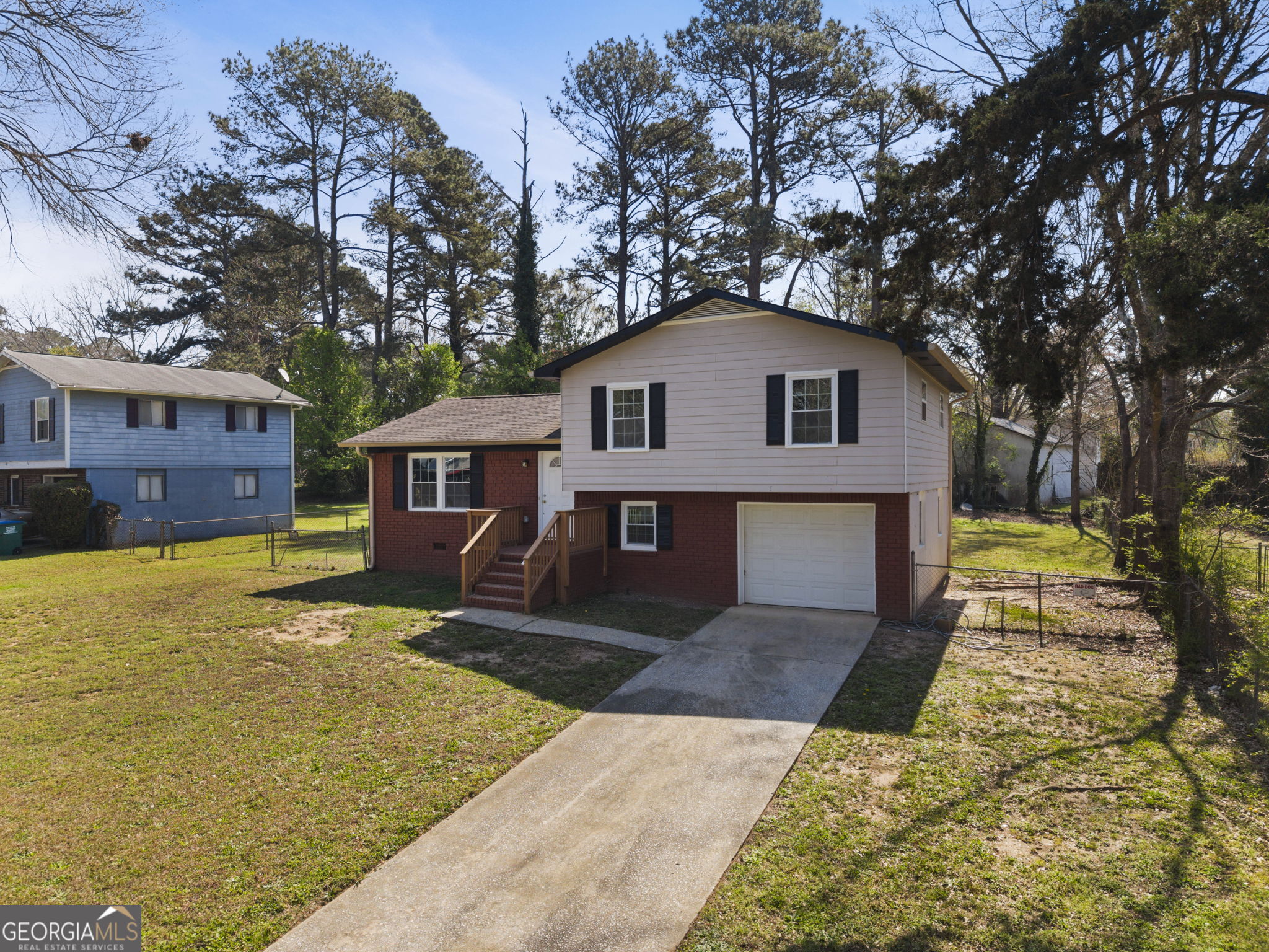 1685 Kinglet Road Jonesboro, GA 30238 - Photo 3 of 34 a front view of a house with a yard