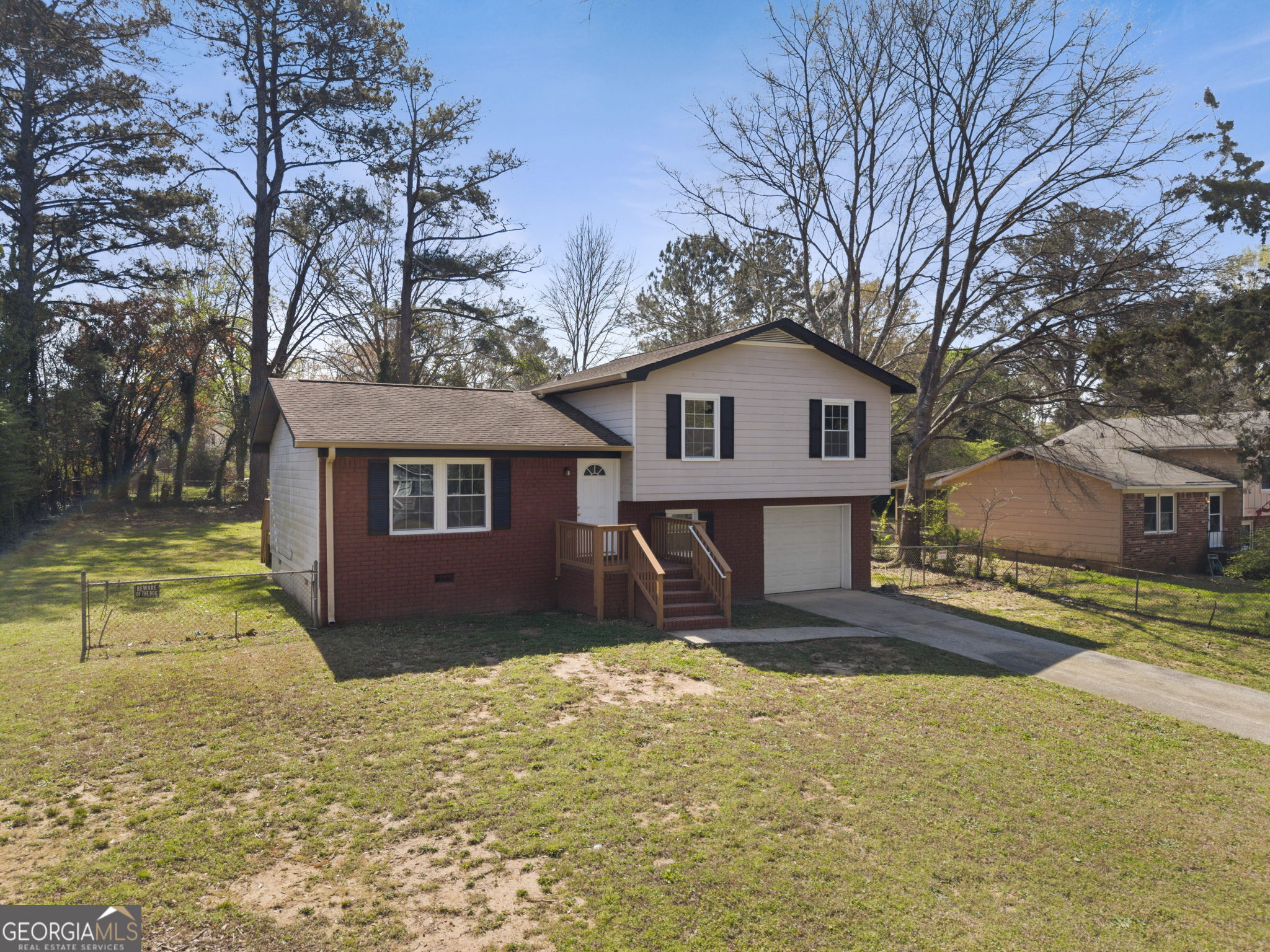 1685 Kinglet Road Jonesboro, GA 30238 - Photo 4 of 34 a view of a house with a yard covered in snow
