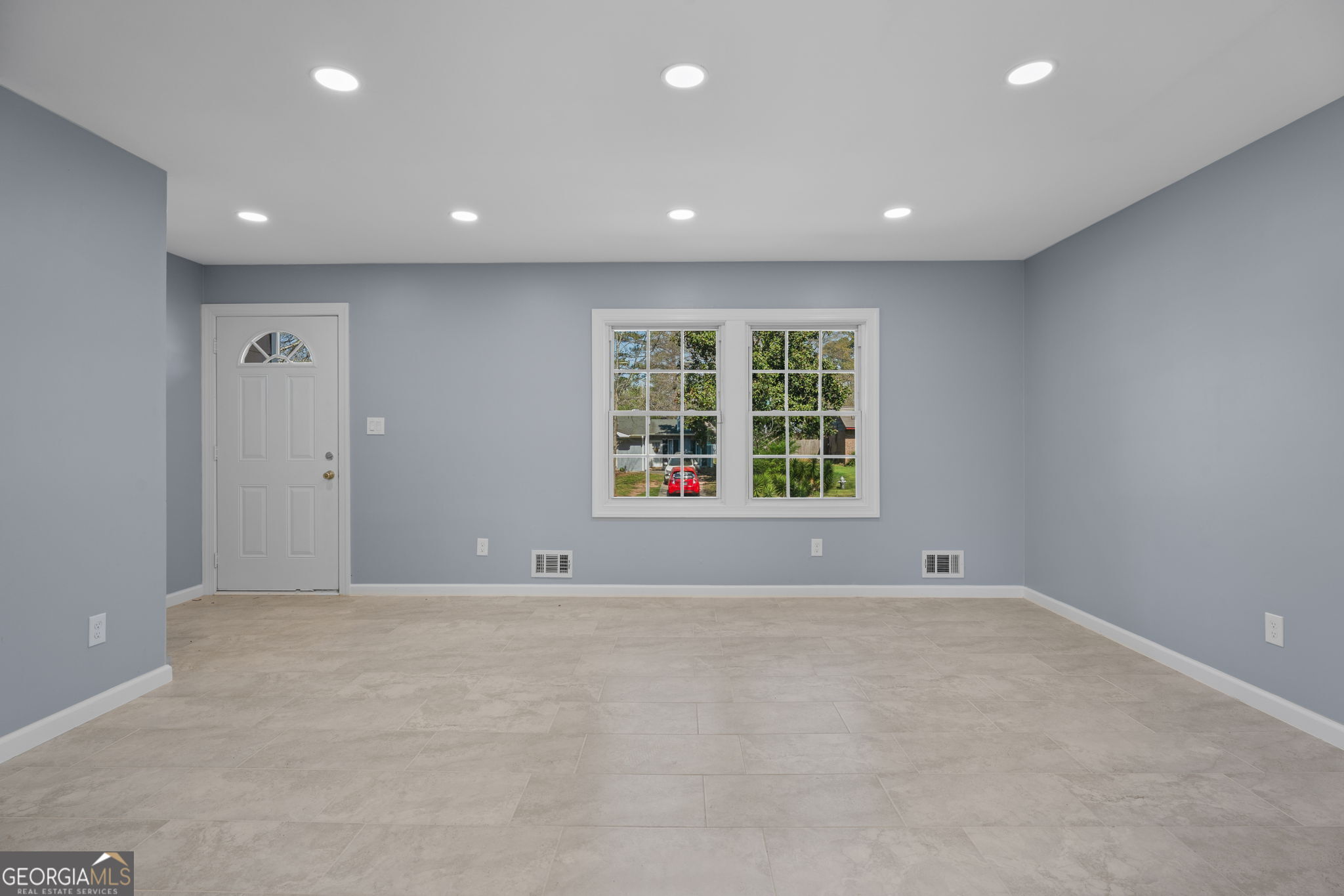 1685 Kinglet Road Jonesboro, GA 30238 - Photo 5 of 34 an empty room with windows and windows