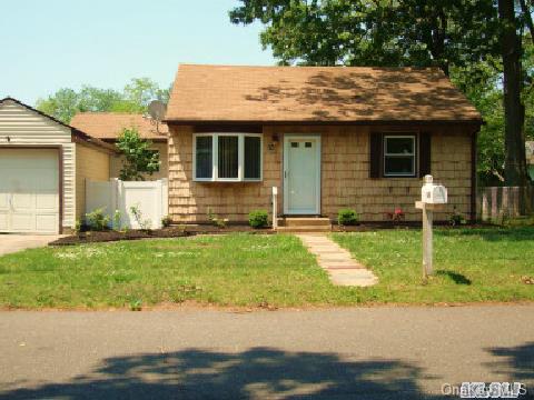 40 Gould Road Centereach, NY 11720 - Photo 1 of 1 a front view of house with yard
