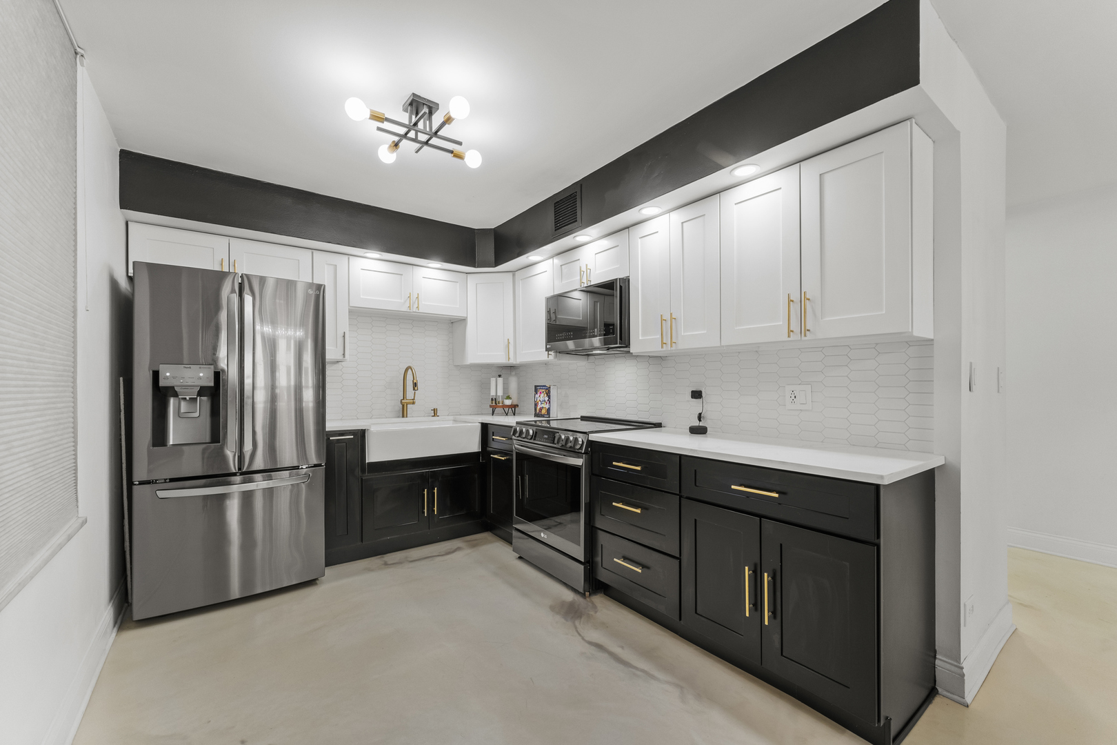 201 East Chestnut Street, Unit 11E Chicago, IL 60611 - Photo 13 of 43 a kitchen with kitchen island a sink stainless steel appliances and cabinets