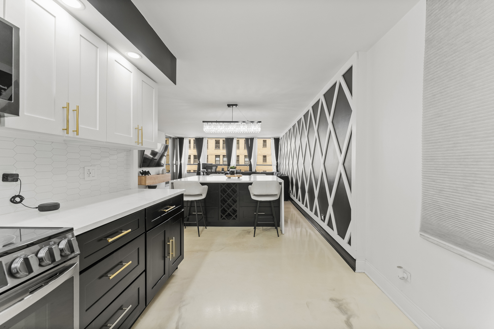 201 East Chestnut Street, Unit 11E Chicago, IL 60611 - Photo 14 of 43 a kitchen with granite countertop a sink a stove top oven and cabinetry