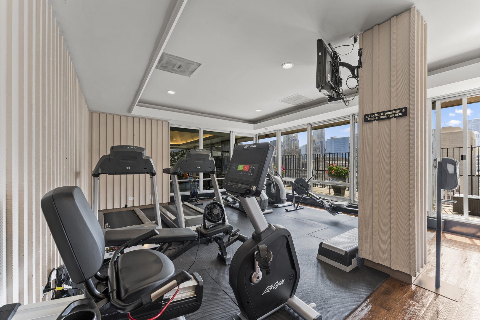 201 East Chestnut Street, Unit 11E Chicago, IL 60611 - Photo 28 of 43 a view of a room with gym equipment