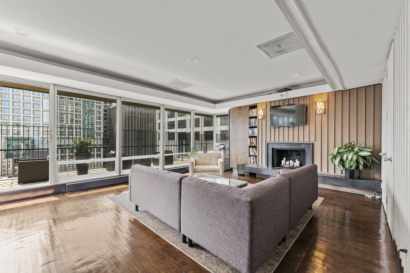 201 East Chestnut Street, Unit 11E Chicago, IL 60611 - Photo 29 of 43 a living room with furniture and a fireplace