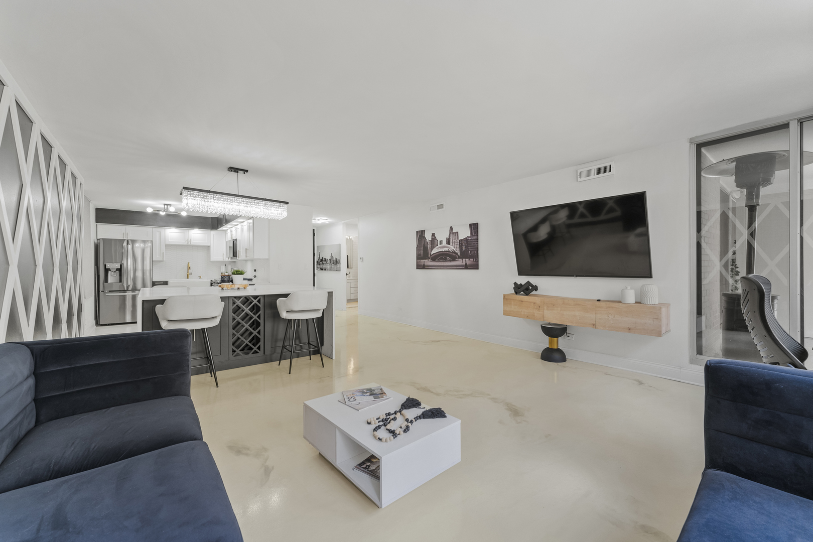 201 East Chestnut Street, Unit 11E Chicago, IL 60611 - Photo 7 of 43 a living room with furniture and a flat screen tv