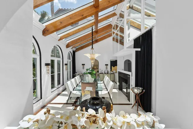 a bed room with a bed and a balcony