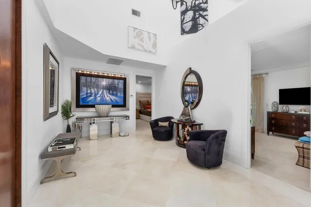 an aerial view of a house with a swimming pool yard and outdoor seating