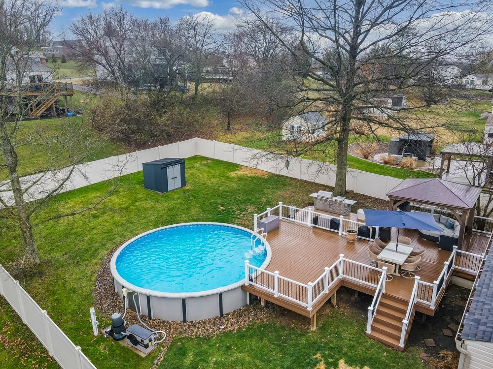 136 Ridgewood Drive Economy, PA 15042 - Photo 2 of 17 a view of a swimming pool with a lounge chair