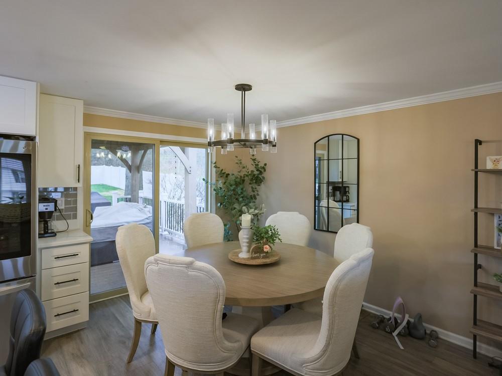 136 Ridgewood Drive Economy, PA 15042 - Photo 4 of 17 a dining room with furniture a chandelier and window