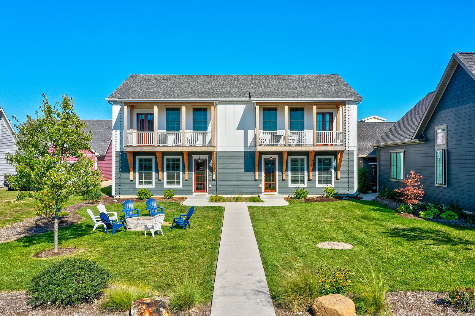 a front view of a house with a yard table and chairs