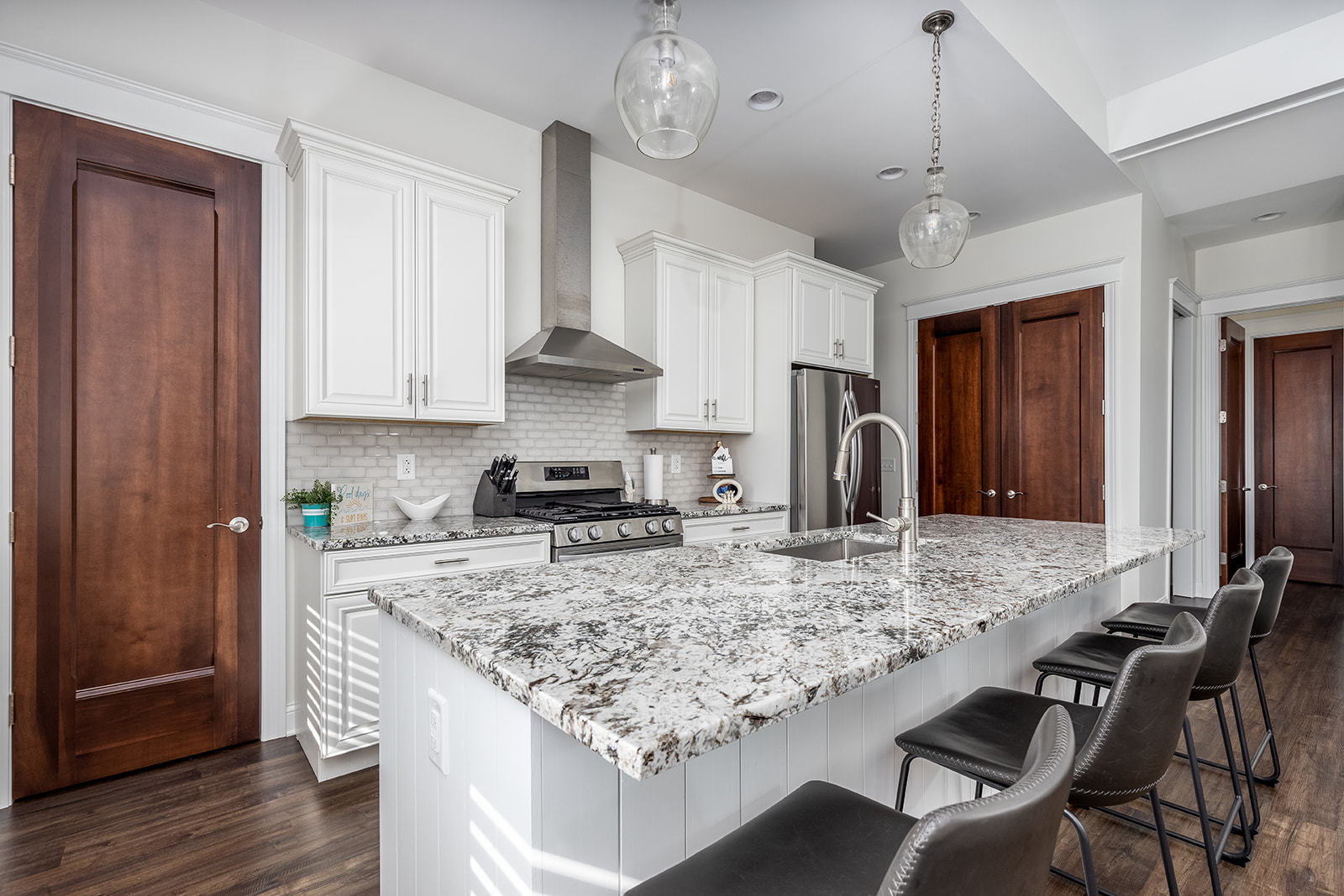 8 Port Place Ottawa, IL 61350 - Photo 14 of 32 a kitchen with kitchen island granite countertop a table chairs a sink and refrigerator