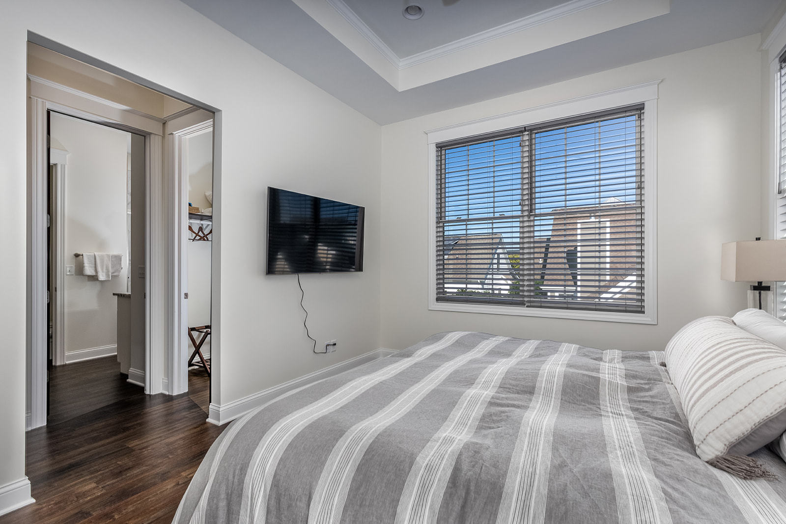 8 Port Place Ottawa, IL 61350 - Photo 19 of 32 a bedroom with a bed and a flat screen tv