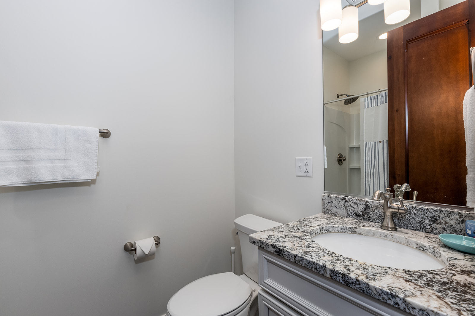 8 Port Place Ottawa, IL 61350 - Photo 21 of 32 a bathroom with a granite countertop toilet sink and mirror