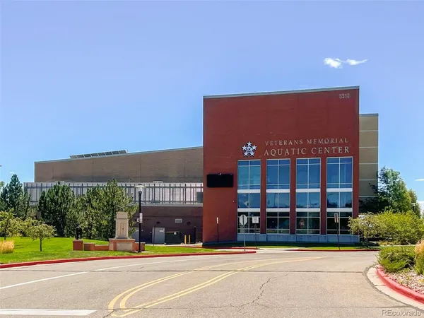 a view of building with a garden