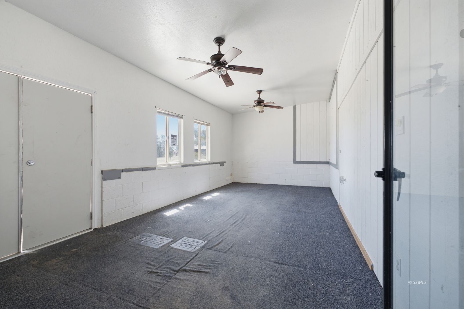 3443 3rd Street Inyokern, CA 93527 - Photo 16 of 24 a view of a livingroom with a ceiling fan and window