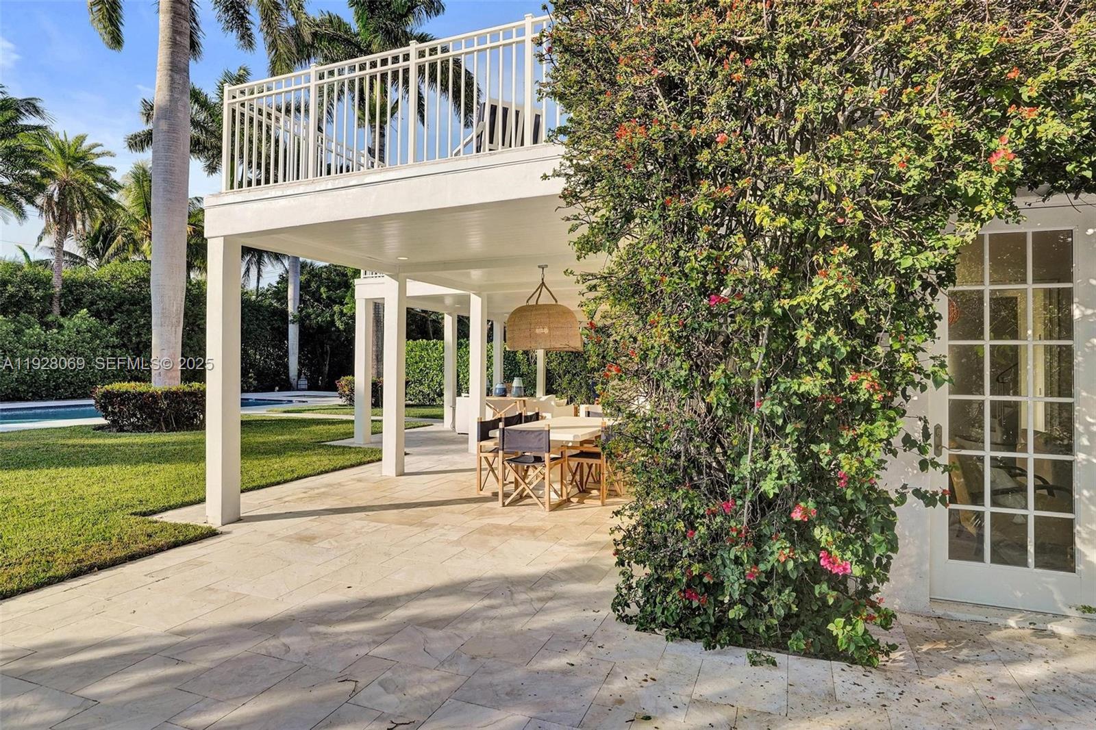 1281 Banyan Road Boca Raton, FL 33432 - Photo 19 of 69 a view of a house with backyard and sitting area