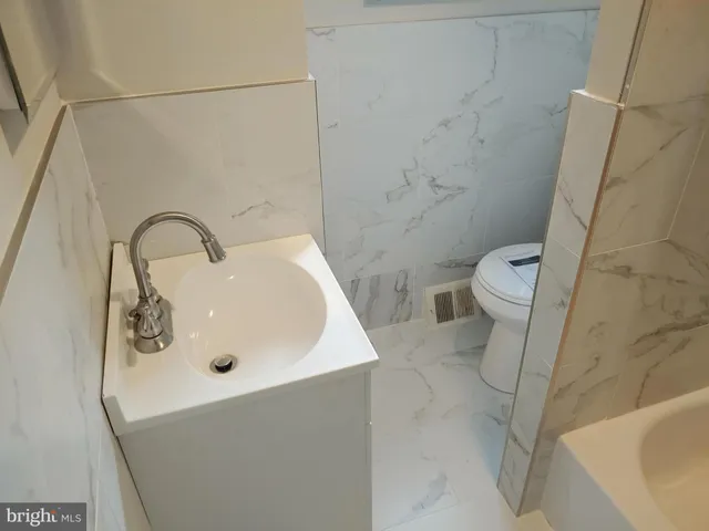 a bathroom with a sink and a toilet