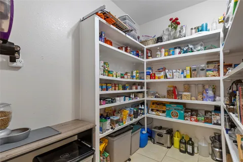 a room with furniture and a book shelf