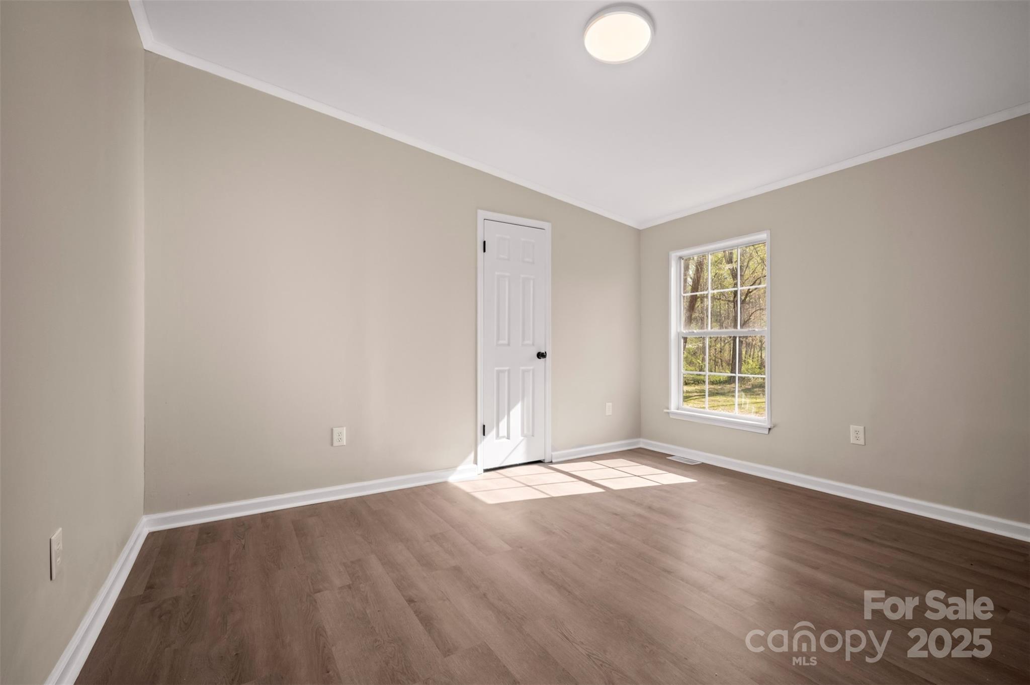 3114 Bostic Sunshine Highway Bostic, NC 28018 - Photo 15 of 48 an empty room with wooden floor and windows