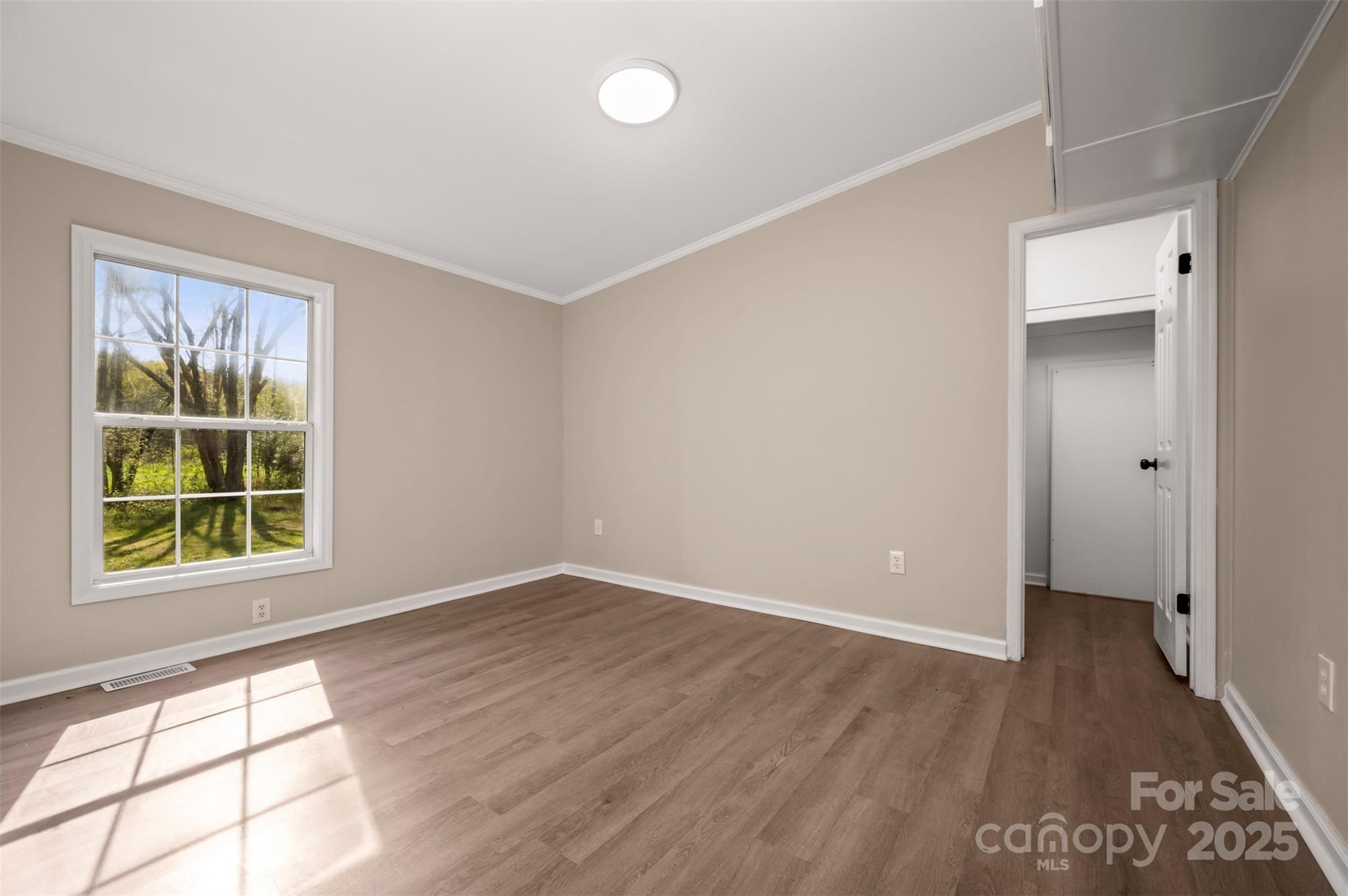 3114 Bostic Sunshine Highway Bostic, NC 28018 - Photo 18 of 48 an empty room with wooden floor and windows