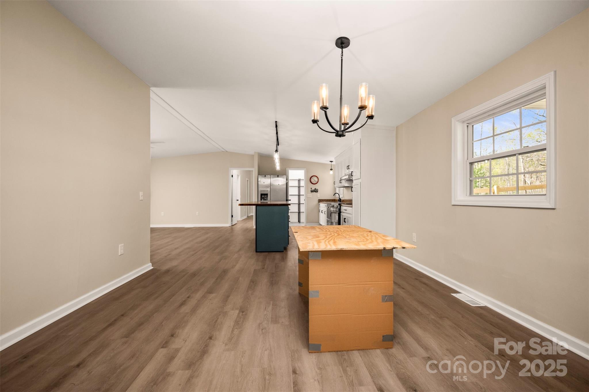 3114 Bostic Sunshine Highway Bostic, NC 28018 - Photo 21 of 48 a view of a room with wooden floor kitchen view and a window