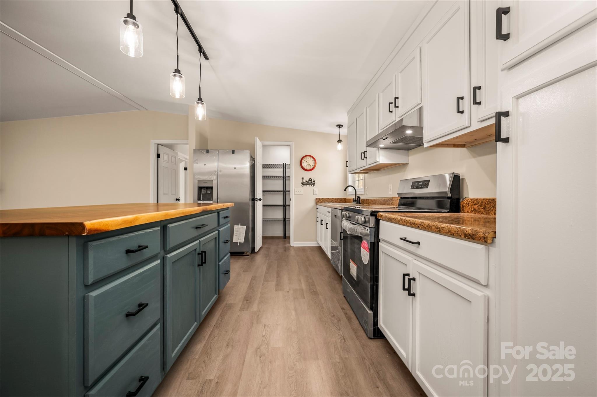 3114 Bostic Sunshine Highway Bostic, NC 28018 - Photo 23 of 48 a kitchen with stainless steel appliances sink stove and cabinets