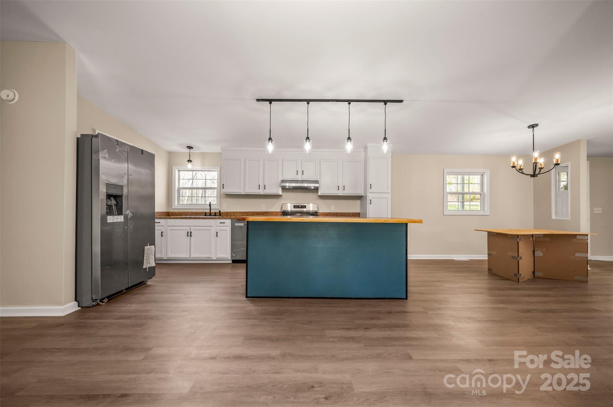 3114 Bostic Sunshine Highway Bostic, NC 28018 - Photo 26 of 48 a kitchen with kitchen island stainless steel appliances a sink refrigerator and window