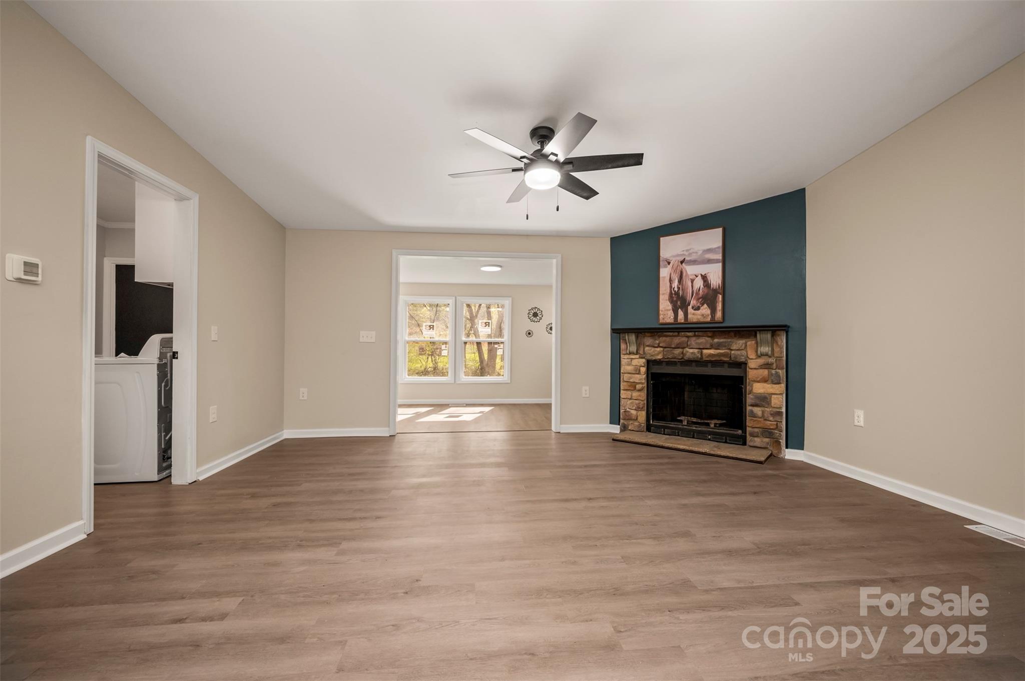 3114 Bostic Sunshine Highway Bostic, NC 28018 - Photo 27 of 48 a view of an empty room with a fireplace and a window
