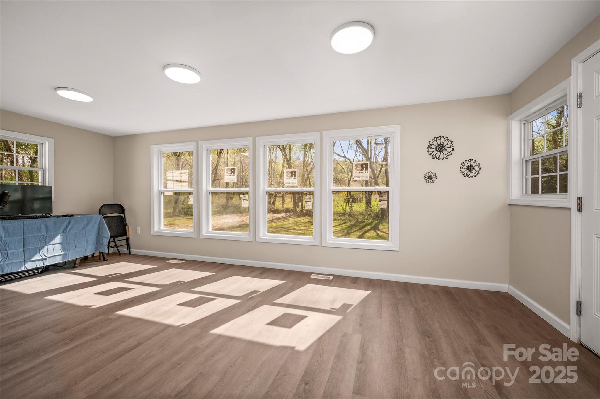 3114 Bostic Sunshine Highway Bostic, NC 28018 - Photo 30 of 48 a view of an empty room with a window and wooden floor