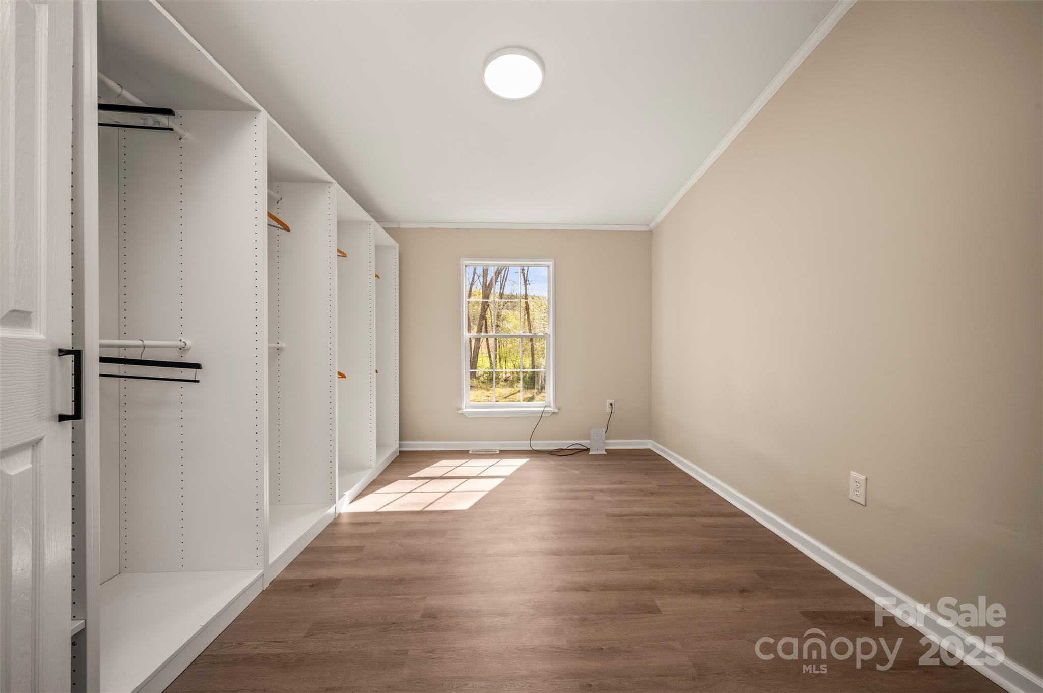 3114 Bostic Sunshine Highway Bostic, NC 28018 - Photo 38 of 48 a view of an empty room with window and wooden floor