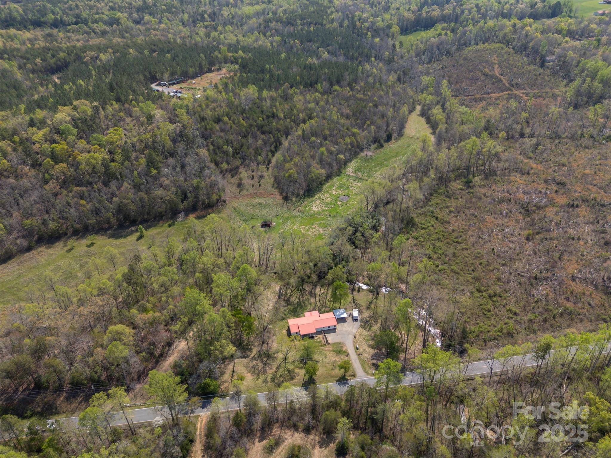 3114 Bostic Sunshine Highway Bostic, NC 28018 - Photo 48 of 48 a backyard of a house with a yard and green space