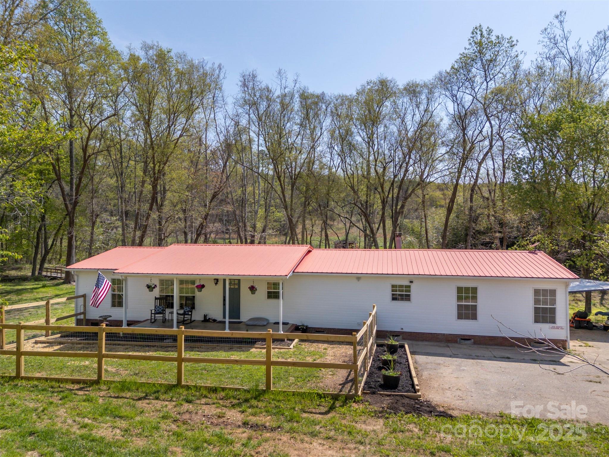 3114 Bostic Sunshine Highway Bostic, NC 28018 - Photo 6 of 48 a roof deck with table and chairs under an umbrella
