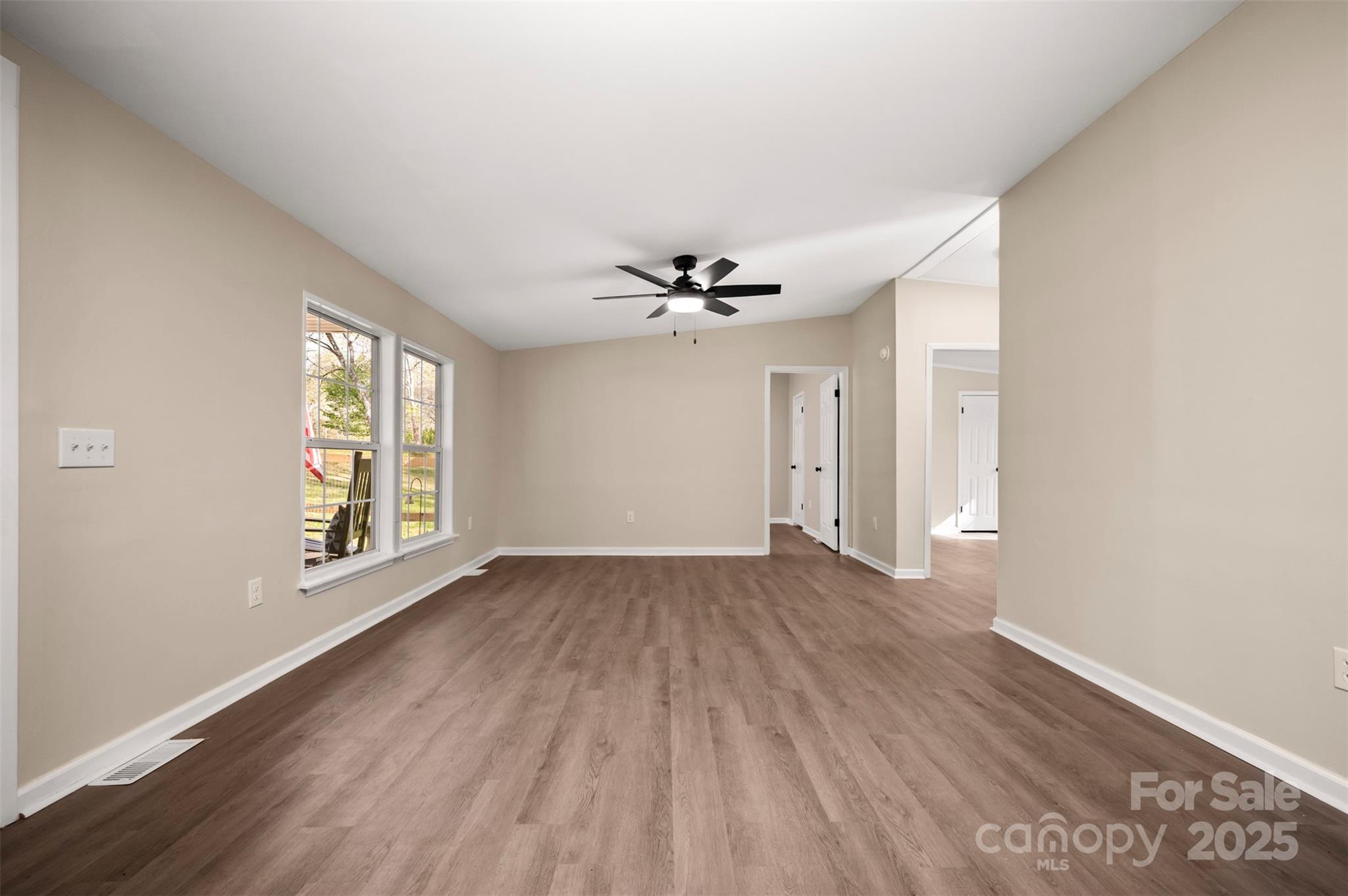 3114 Bostic Sunshine Highway Bostic, NC 28018 - Photo 10 of 48 a view of an empty room with wooden floor and a window